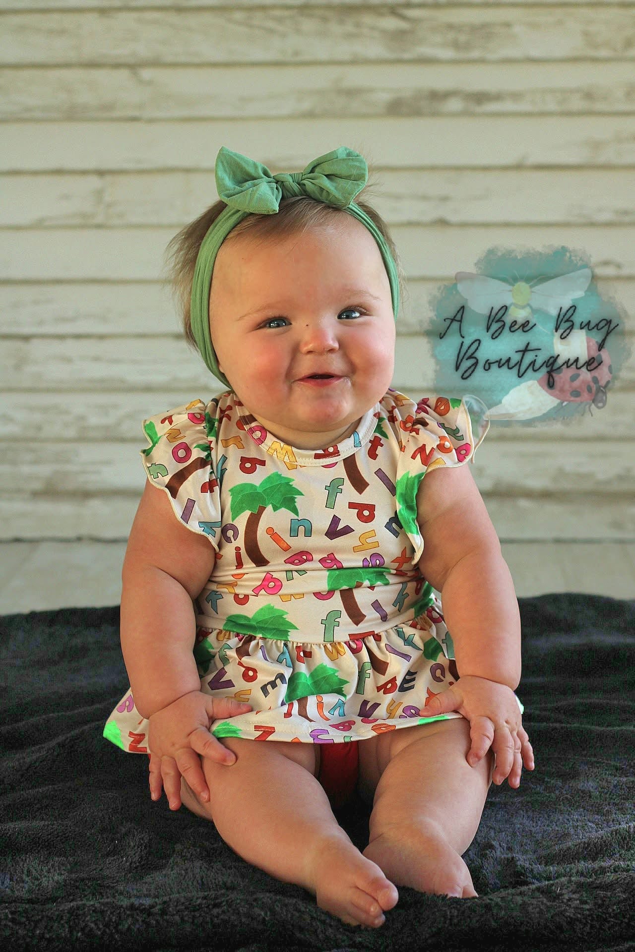 Alphabet Jungle Peplum Top