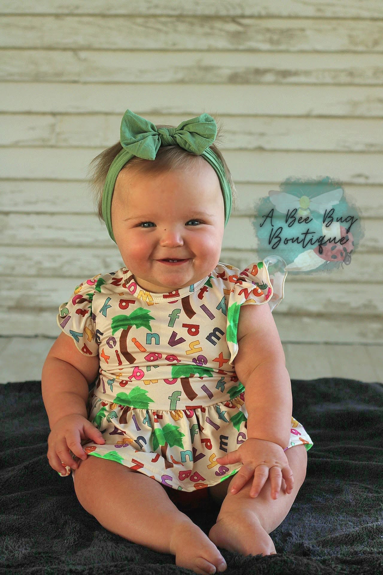 Alphabet Jungle Peplum Top