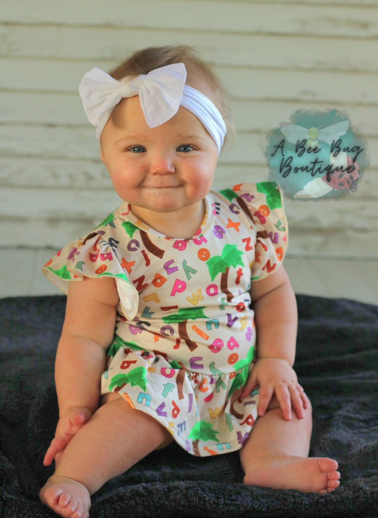 Alphabet Jungle Peplum Top