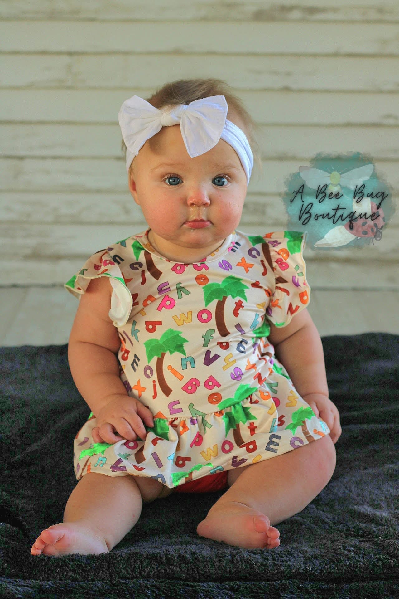 Alphabet Jungle Peplum Top